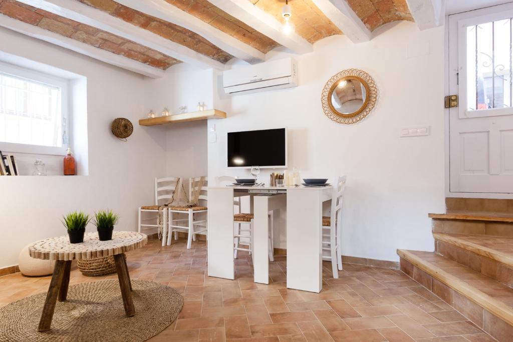 Televízia a/alebo spoločenská miestnosť v ubytovaní L'Havanera Boutique Home