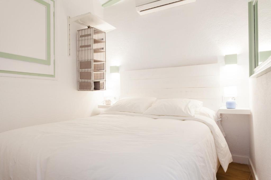 Posteľ alebo postele v izbe v ubytovaní L'Havanera Boutique Home