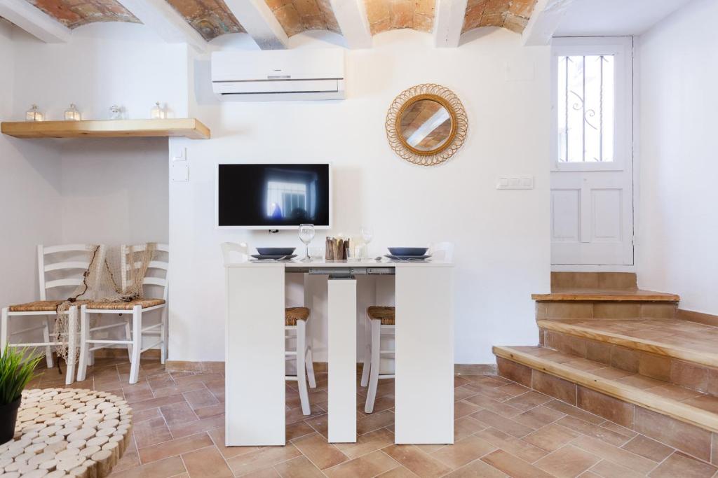 Televízia a/alebo spoločenská miestnosť v ubytovaní L'Havanera Boutique Home