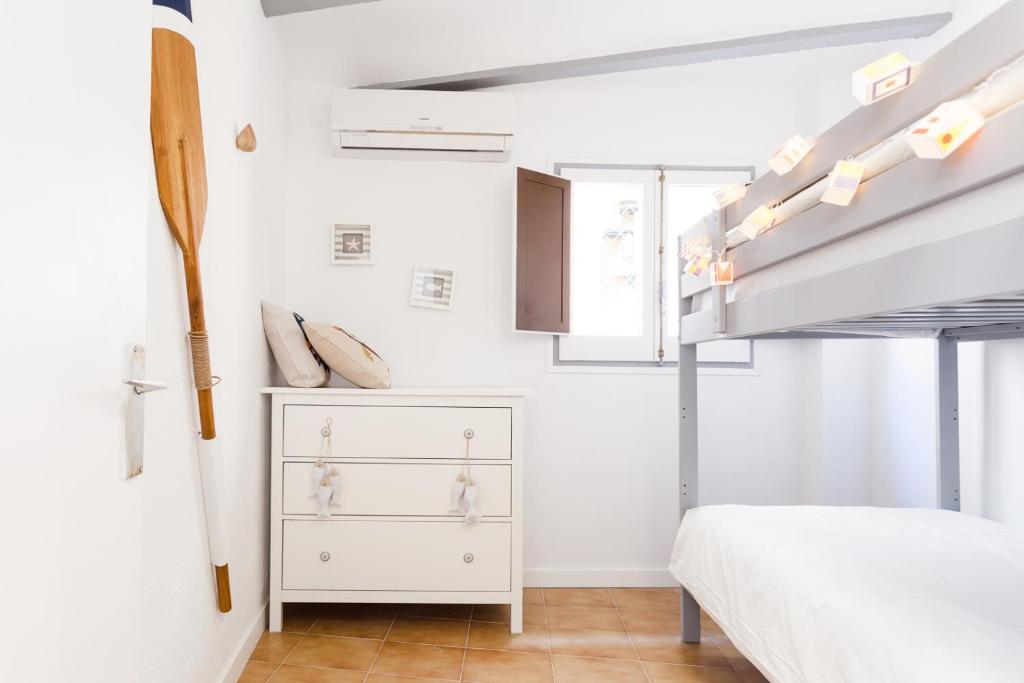 Posteľ alebo postele v izbe v ubytovaní L'Havanera Boutique Home