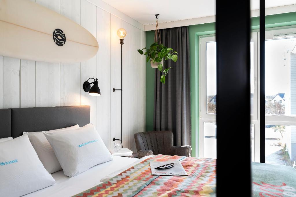 Postel nebo postele na pokoji v ubytování Beach Motel St. Peter-Ording