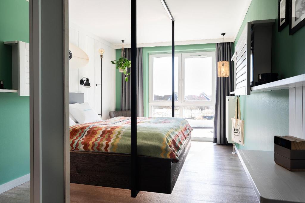 Postel nebo postele na pokoji v ubytování Beach Motel St. Peter-Ording