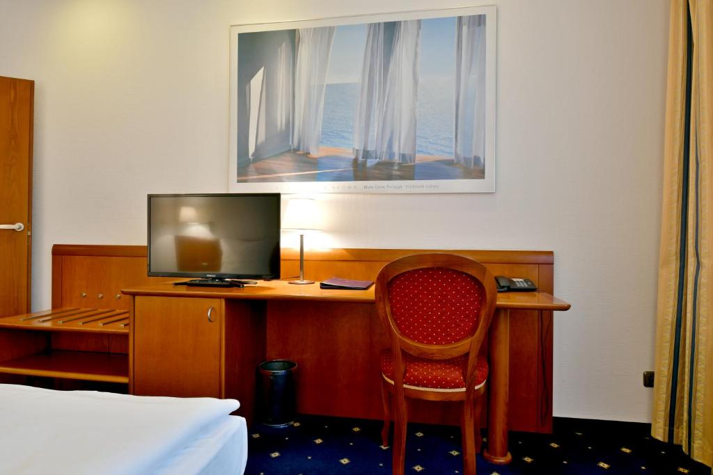 TV a/nebo společenská místnost v ubytování Hotel Coronet