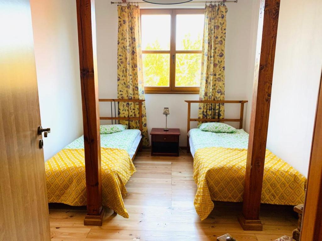 Posteľ alebo postele v izbe v ubytovaní Domjana Lubiatowo