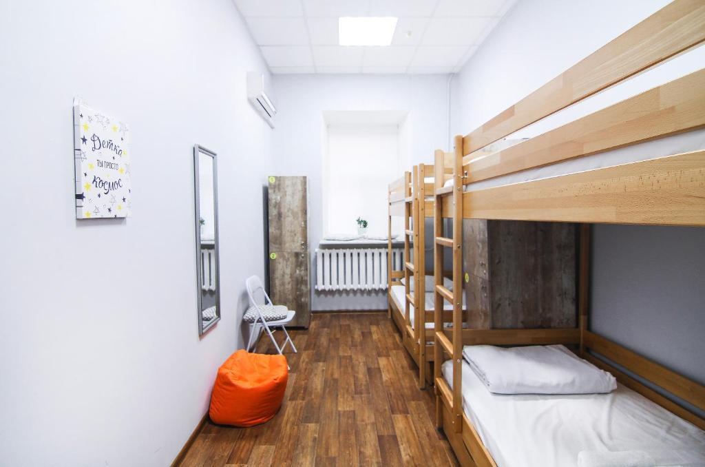 a dorm room with bunk beds and a hallway at Hostel51 in Odesa