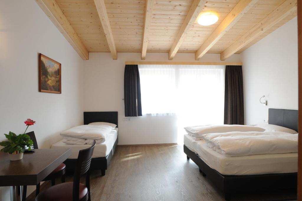 Postel nebo postele na pokoji v ubytování B&B Hotel Heidi