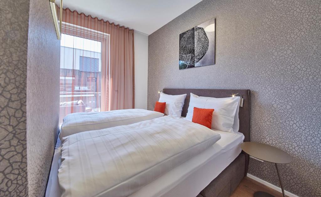 Postel nebo postele na pokoji v ubytování Hermitage Apartments