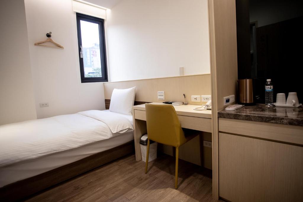 Postel nebo postele na pokoji v ubytování Beauty Avenue Inn
