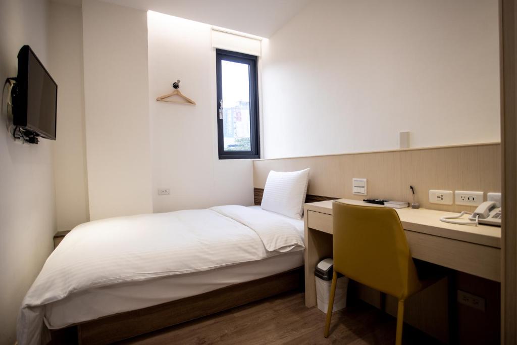 Postel nebo postele na pokoji v ubytování Beauty Avenue Inn
