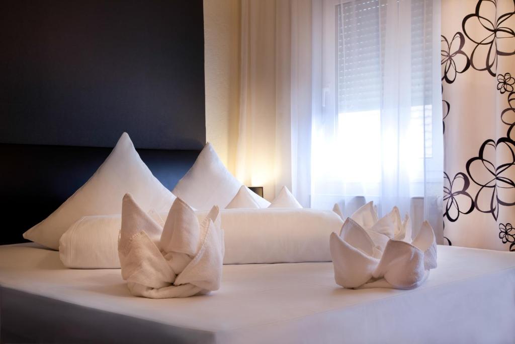 Voodi või voodid majutusasutuse Hotel Riviera toas