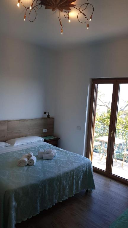 Postel nebo postele na pokoji v ubytování Agriturismo Mare e Monti