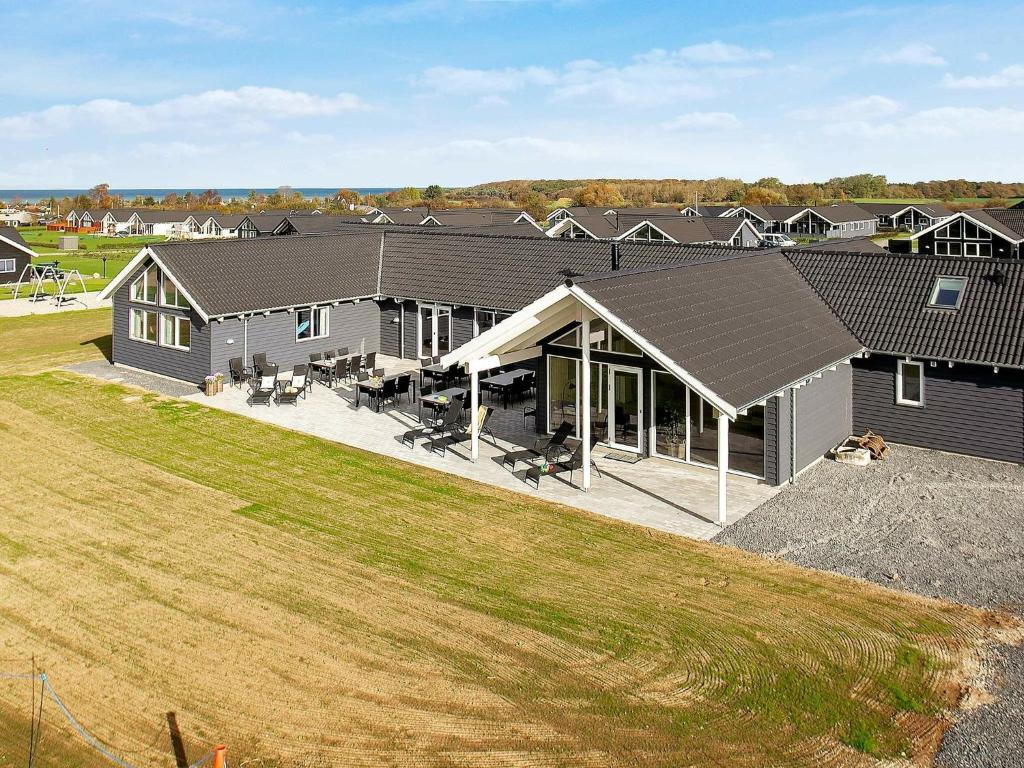 eine Luftansicht eines Hauses mit Hof in der Unterkunft 30 person holiday home in Bogense in Bogense