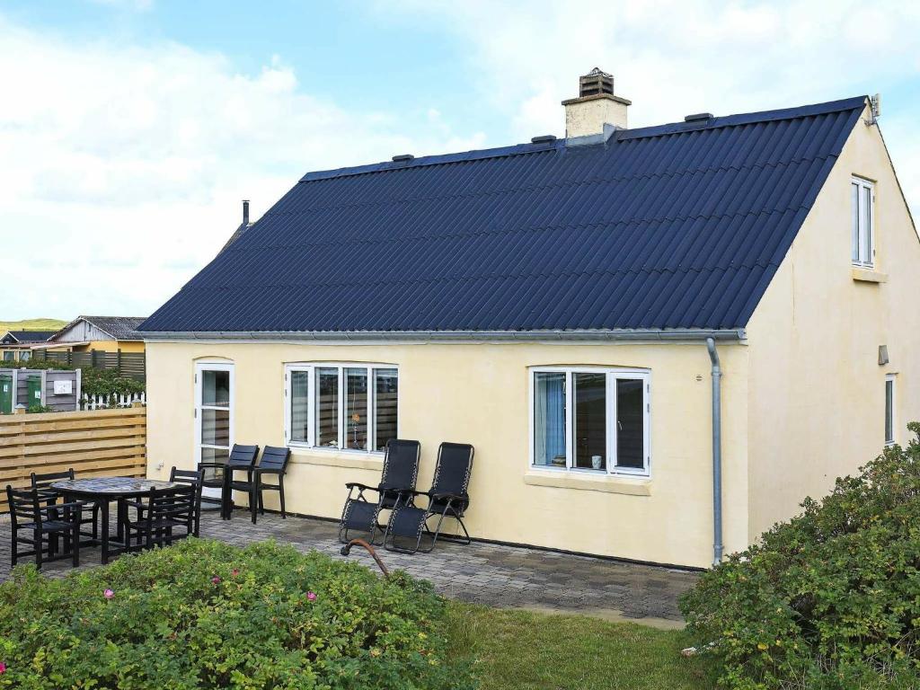 a house with solar panels on the roof at 6 person holiday home in Harbo re in Harboør