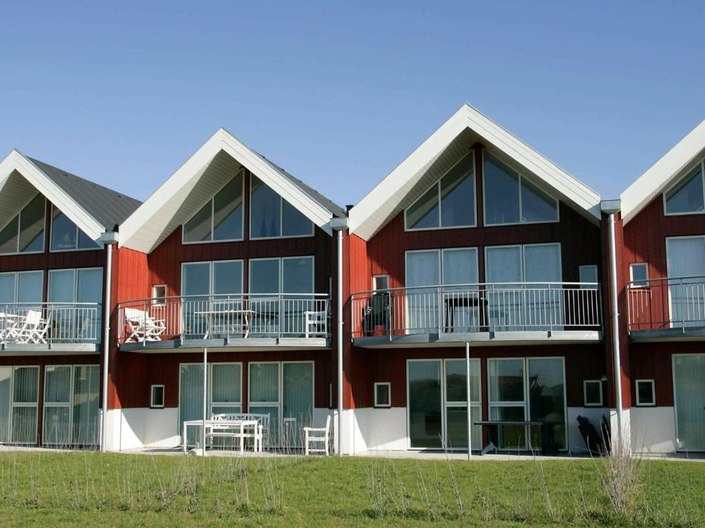 an exterior view of a building with balconies at 6 person holiday home in Løkken-By Traum in Løkken