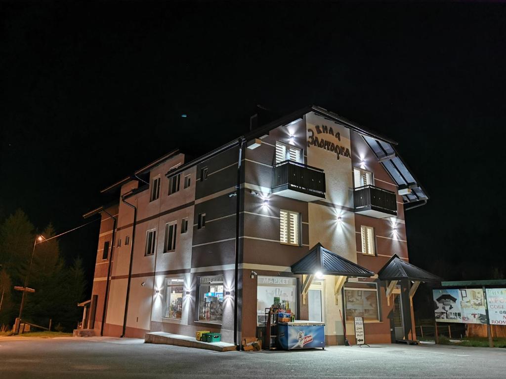 a building with lights on top of it at night at Vila Zlatarka in Nova Varoš