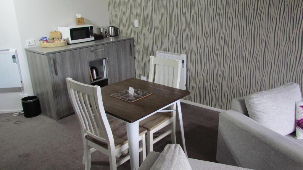 A kitchen or kitchenette at Tongariro Suites