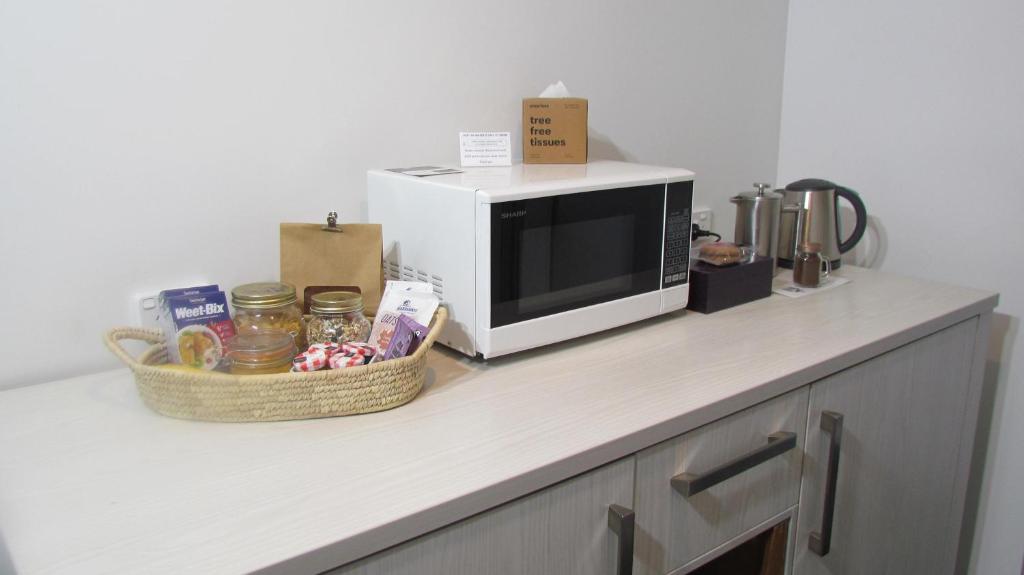 A kitchen or kitchenette at Tongariro Suites