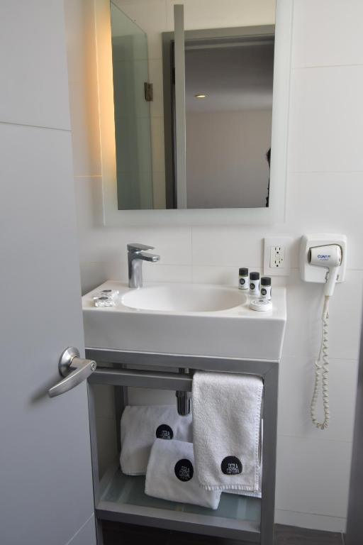 Koupelna v ubytování Hotel Perla Central