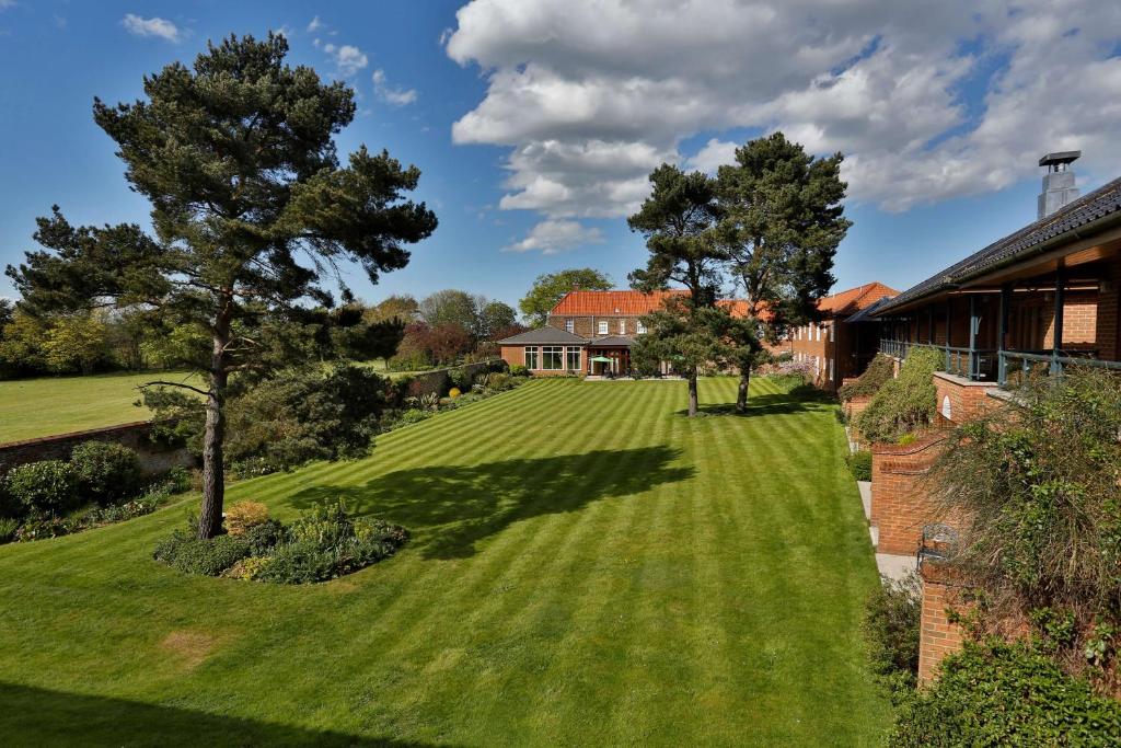 an aerial view of a lawn in front of a house at Kings Lynn Knights Hill Hotel & Spa, BW Signature Collection in King's Lynn