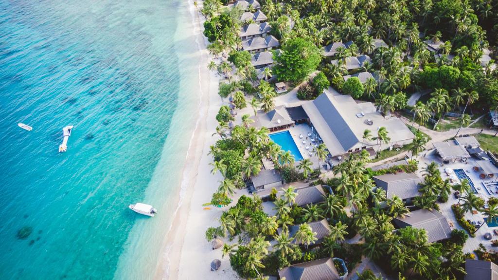 an aerial view of the beach and the ocean at Paradise Cove Resort in Naukacuvu Island