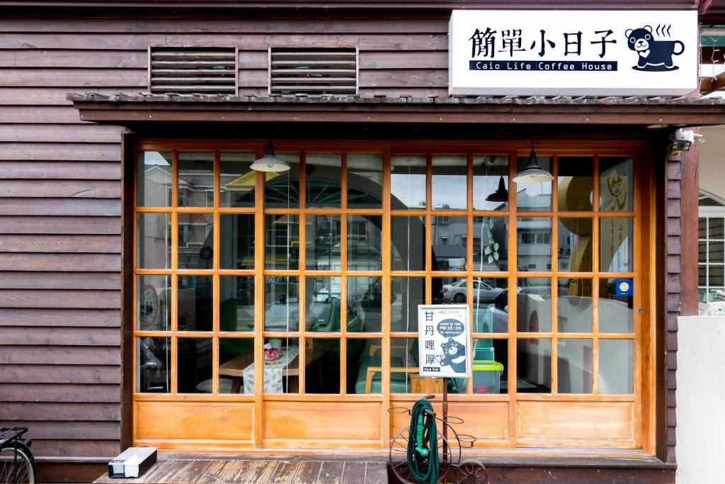 a store front of a building with a window at Ciao Life B&amp;B in Taitung City