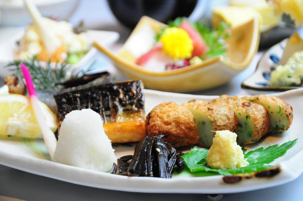 a plate of food with different types of food at Kadoya Hotel in Tokyo