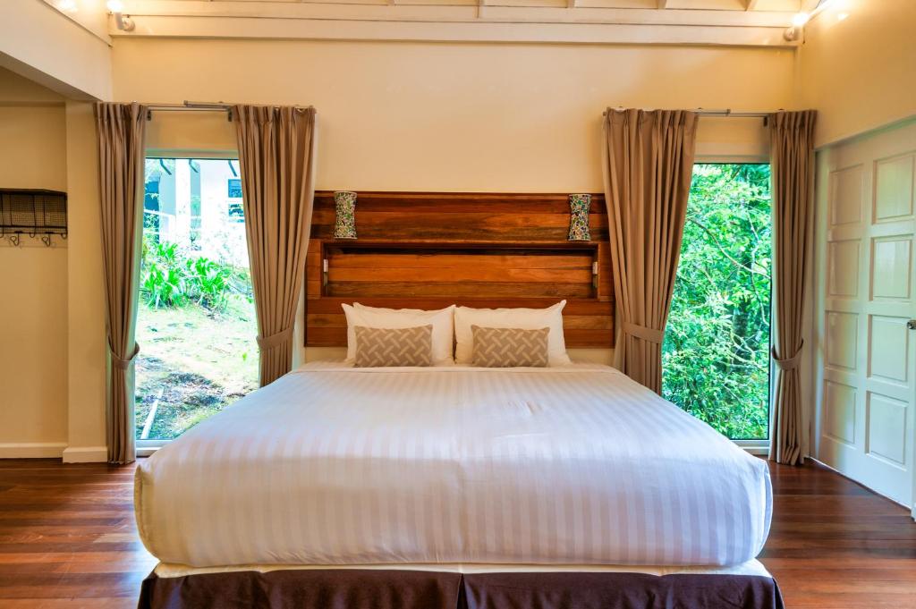 Letto o letti in una camera di Sutera Sanctuary Lodges At Kinabalu Park