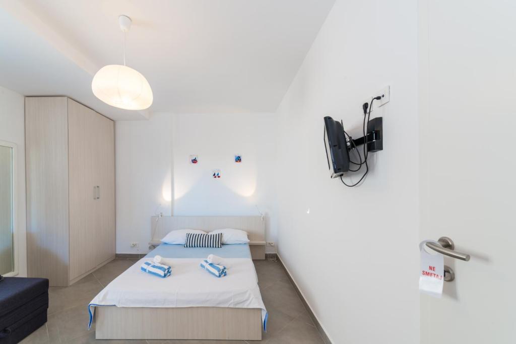 Posteľ alebo postele v izbe v ubytovaní Apartments Keran