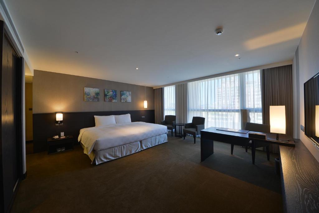 Postel nebo postele na pokoji v ubytování Platinum Hotel