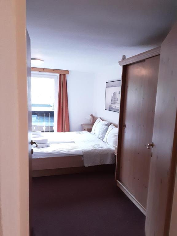 Posteľ alebo postele v izbe v ubytovaní Apartment House Seerose