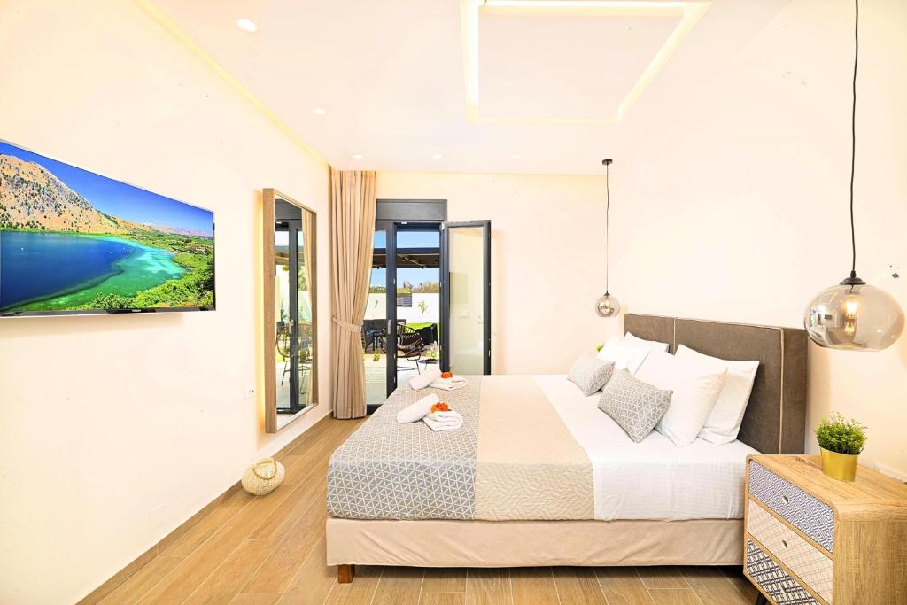Łóżko lub łóżka w pokoju w obiekcie Villa Solaris Heated Pool & Jacuzzi