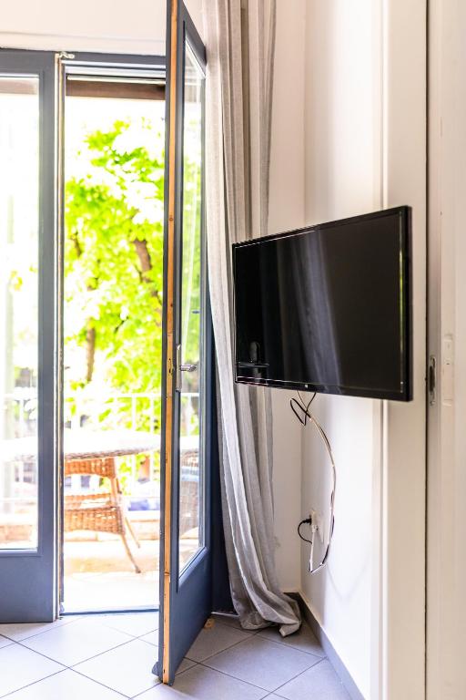 Televízia a/alebo spoločenská miestnosť v ubytovaní Xsoma Flats "Twins"