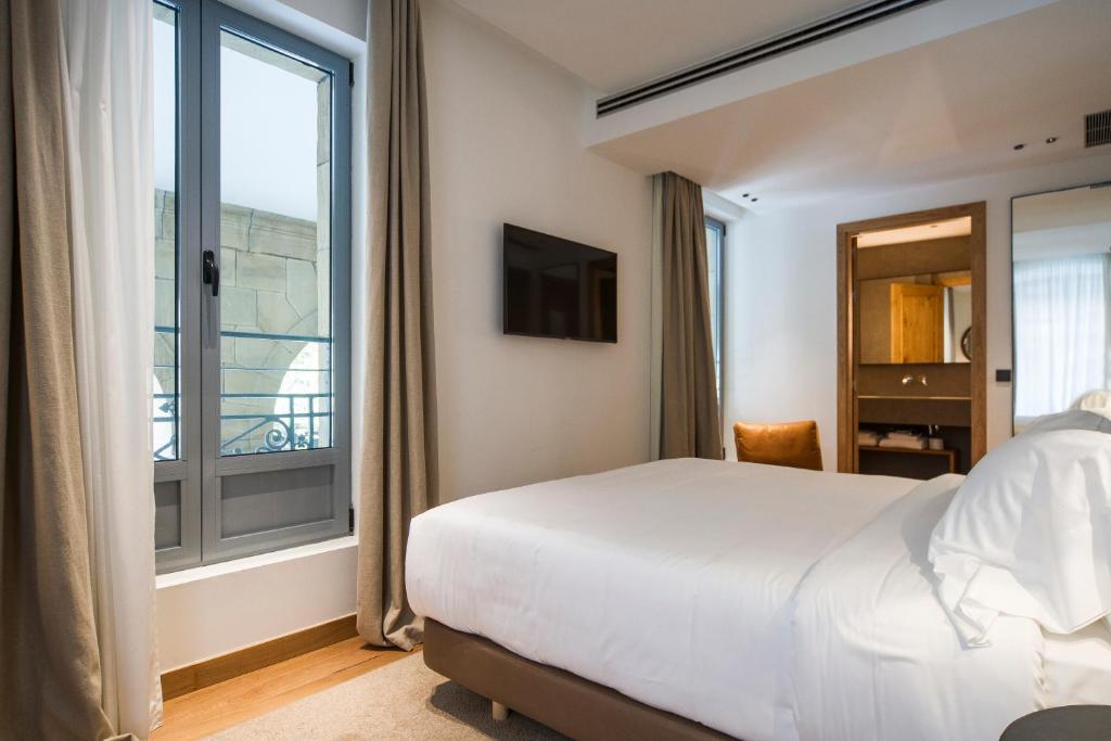 Postel nebo postele na pokoji v ubytování Hotel Arbaso