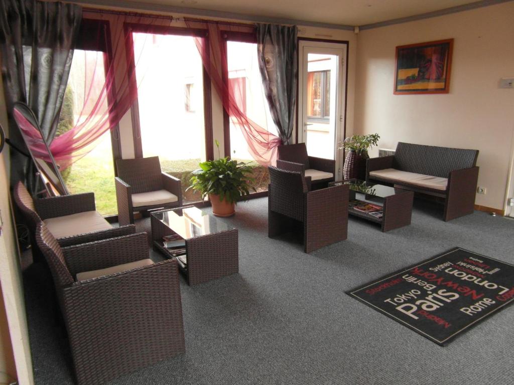 Posezení v ubytování Hôtel Le Forestia