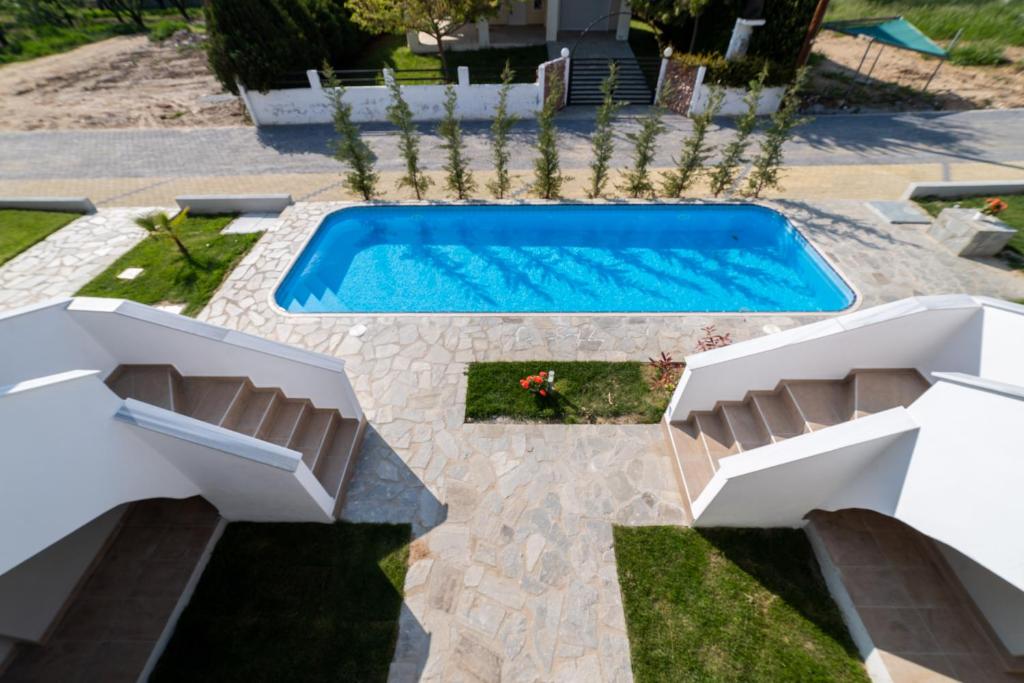 Bazén v ubytování Danai & Palm Residential Complexes nebo v jeho okolí