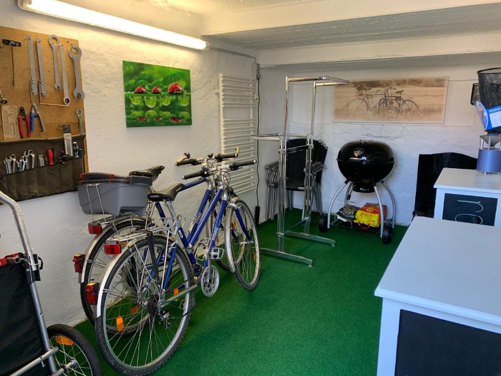 a garage with two bikes parked against a wall at &quot;An der Lindenberganlage&quot; in Melsungen