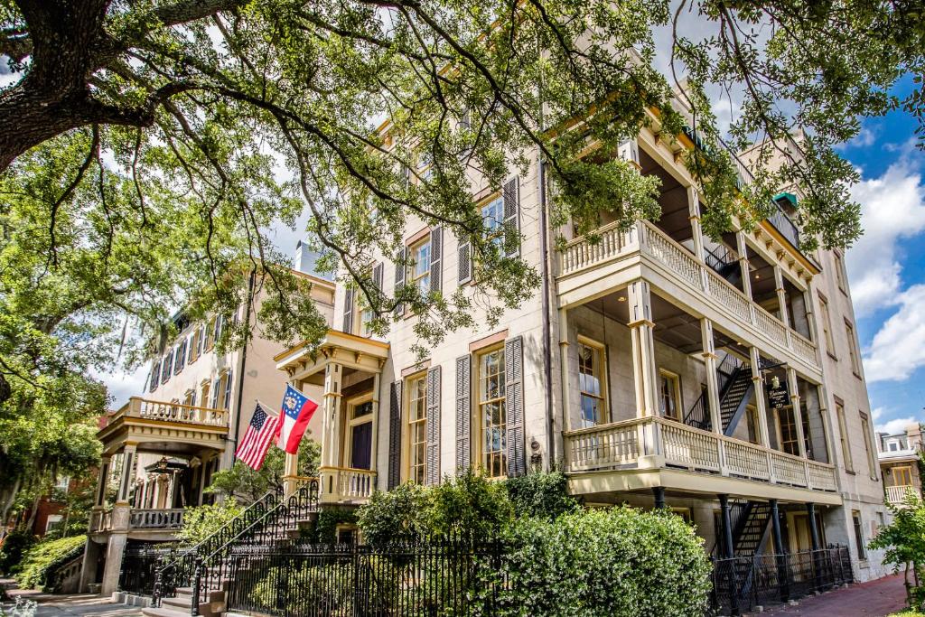 a large white building with balconies at The Gastonian, Historic Inns of Savannah Collection in Savannah