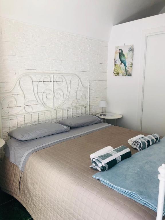 Postel nebo postele na pokoji v ubytování ZI' MARI' - Via Roma