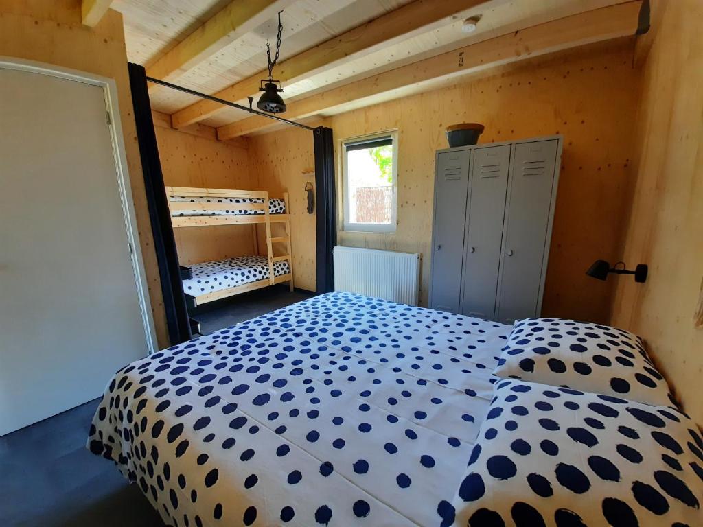 Postel nebo postele na pokoji v ubytování ZTLND Familylodge