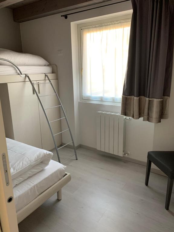Postel nebo postele na pokoji v ubytování Alpin star