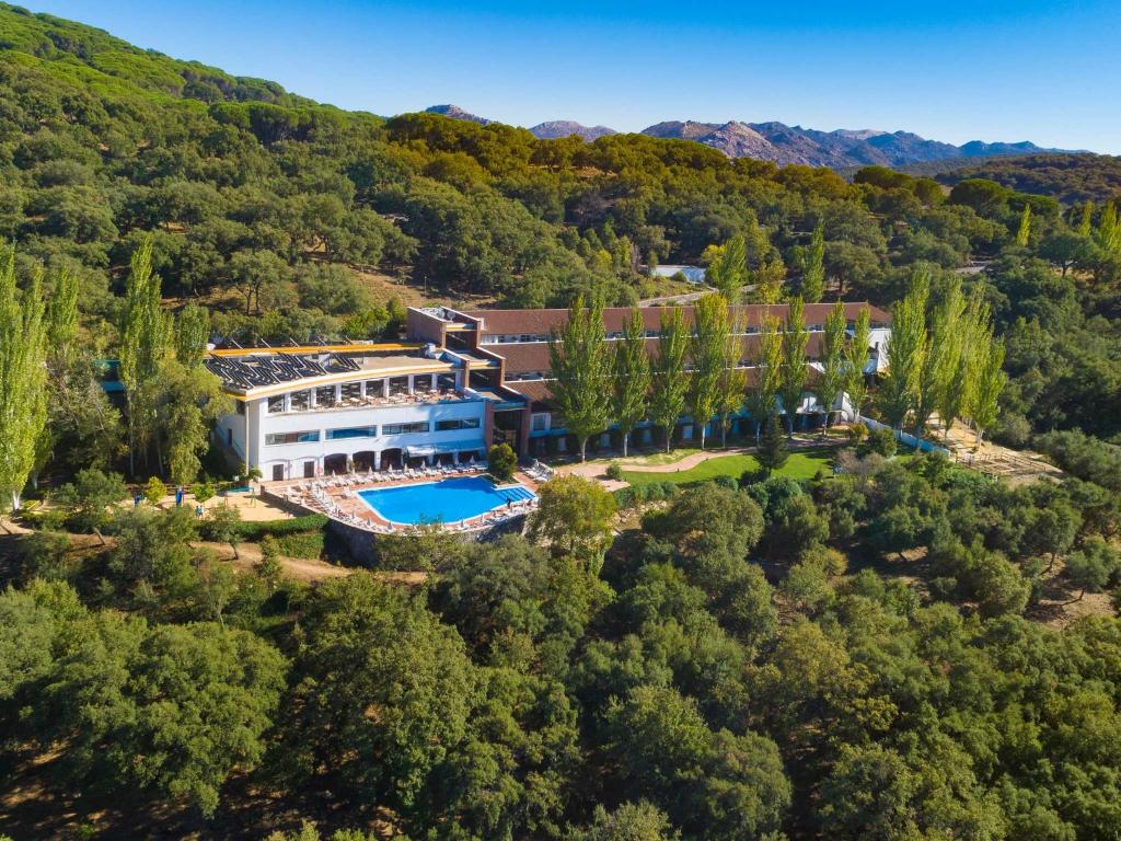 an aerial view of a building in the woods at Hotel Fuerte Grazalema in Grazalema