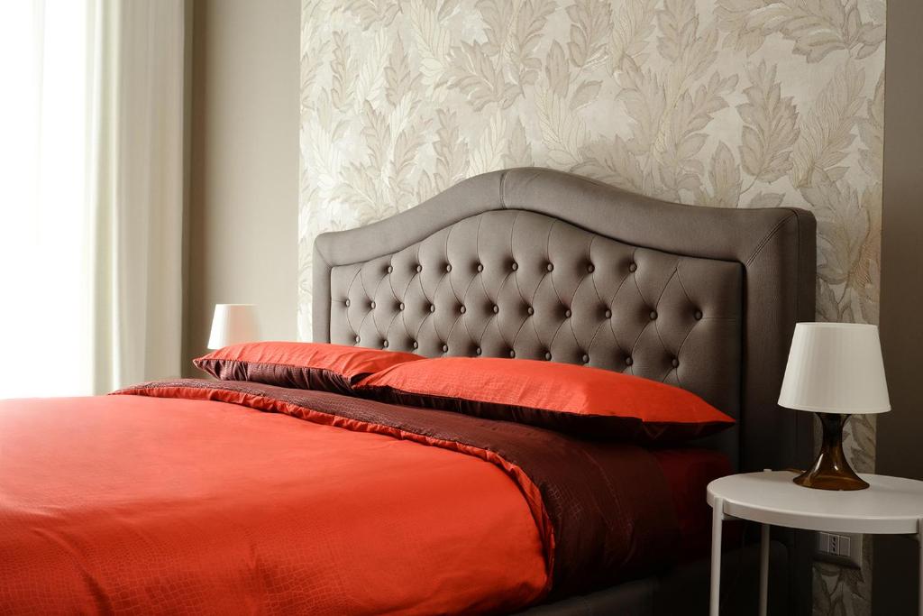 Łóżko lub łóżka w pokoju w obiekcie Filomena Suite Luxury Apartment