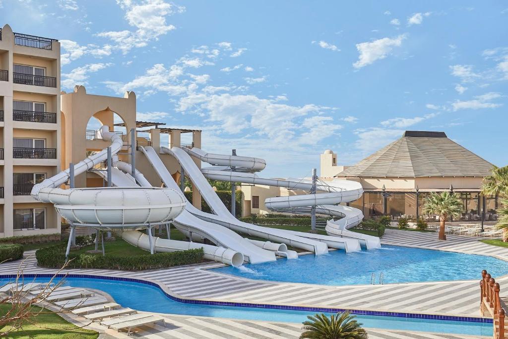 a water slide in a pool at a resort at Steigenberger Aqua Magic Red Sea in Hurghada