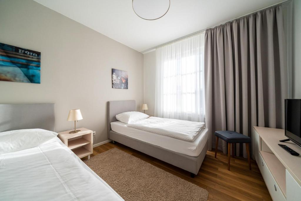 Postel nebo postele na pokoji v ubytování Haus Heidelberg