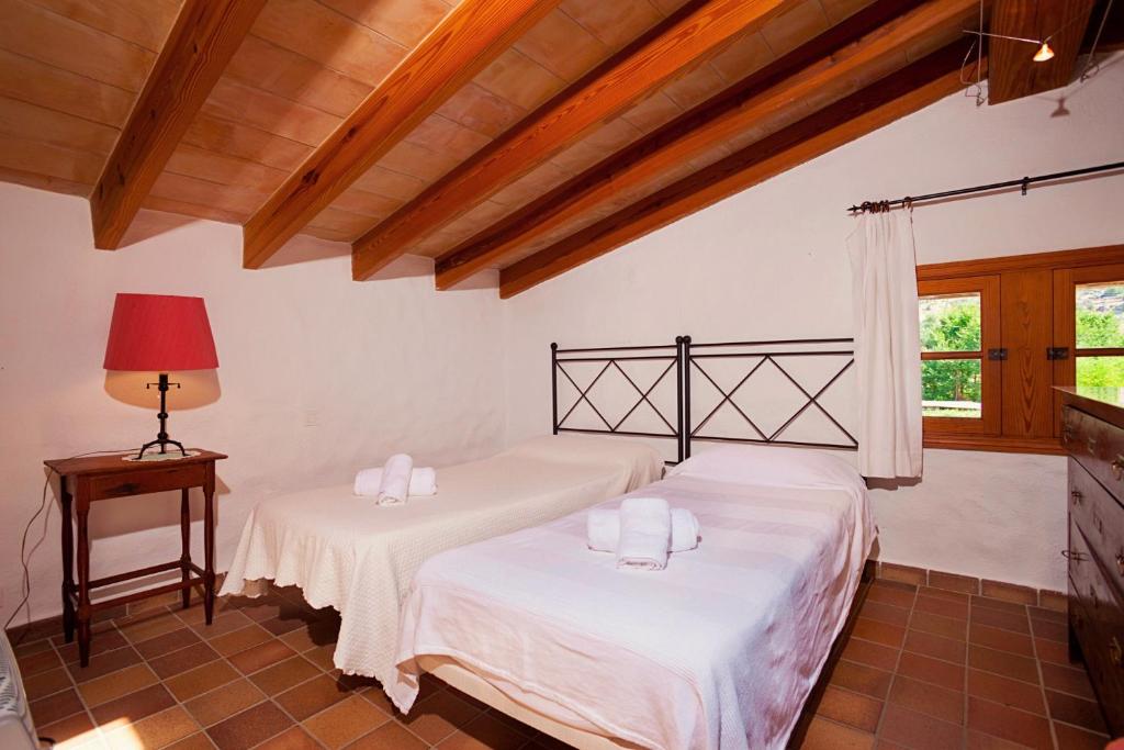 Postel nebo postele na pokoji v ubytování Finca Gloria by Sealand Villas