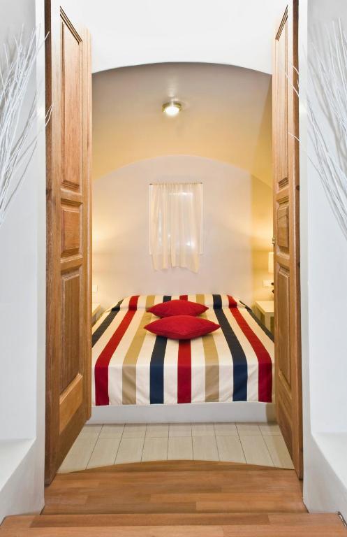 Postel nebo postele na pokoji v ubytování Meltemi Village Hotel