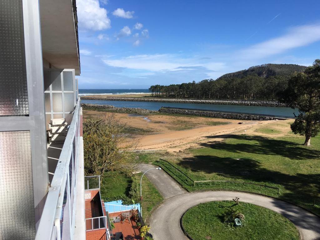 a view of the beach from a balcony of a building at Playa del Puntal Villaviciosa Asturias Lujo Primera Linea Playa in Villaviciosa