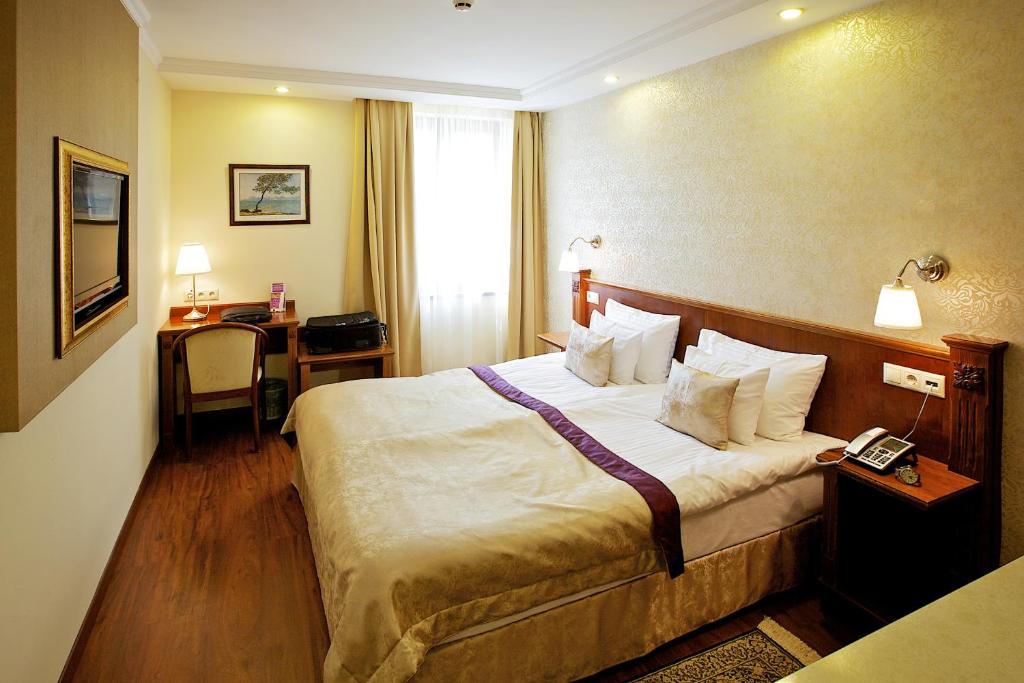 Posteľ alebo postele v izbe v ubytovaní Gold Hotel Budapest