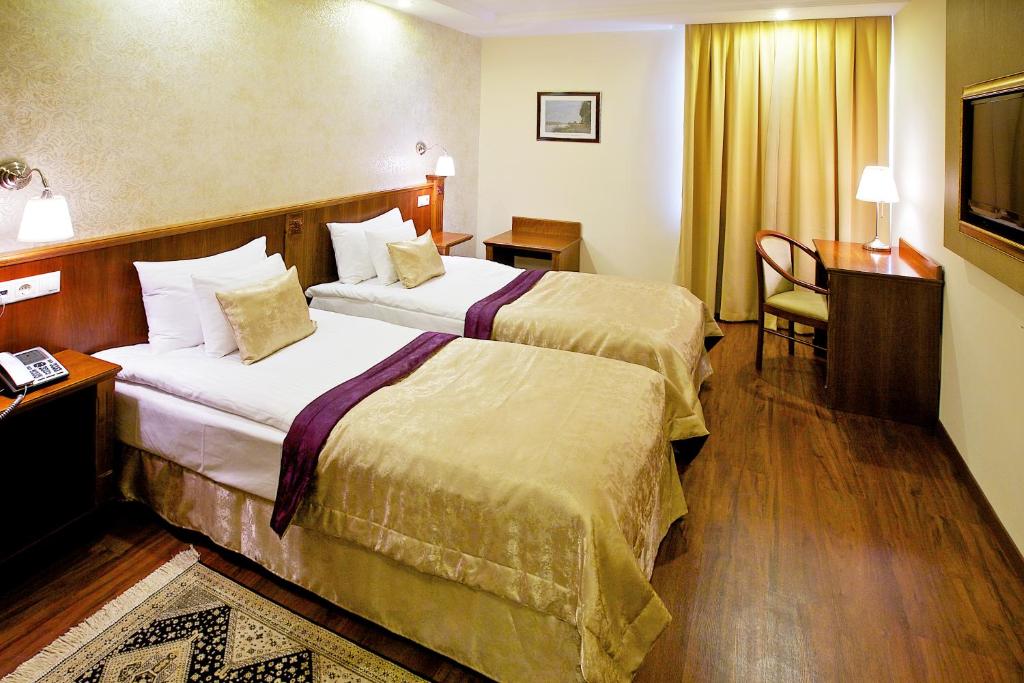 Posteľ alebo postele v izbe v ubytovaní Gold Hotel Budapest