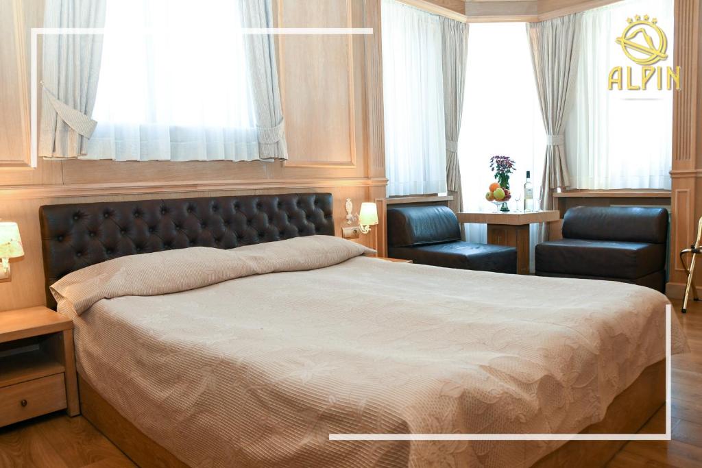 Postel nebo postele na pokoji v ubytování Alpin Borovets, Алпин Боровец